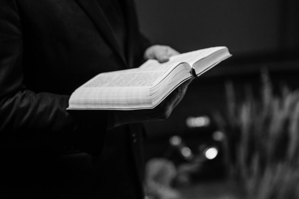 holding open Bible
